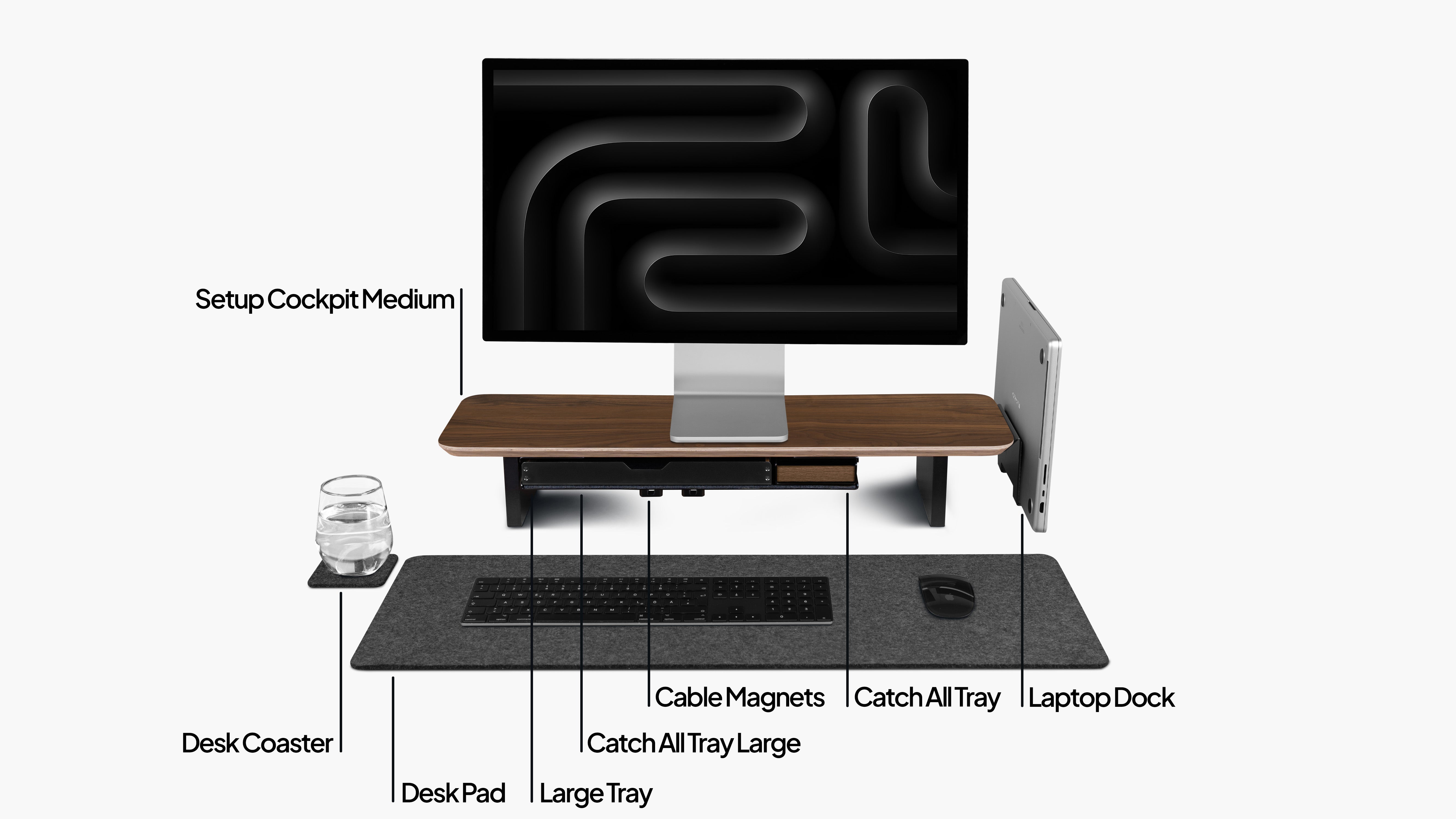 Setup Cockpit Desk Shelf Medium in American Walnut, as a bundle set with add-ons: Laptop Dock, Large Tray, Catch all Trays, cable magnets and desk pad. Labeled for illustration purposes.